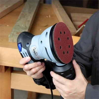 Papier de verre installe sur une ponceuse