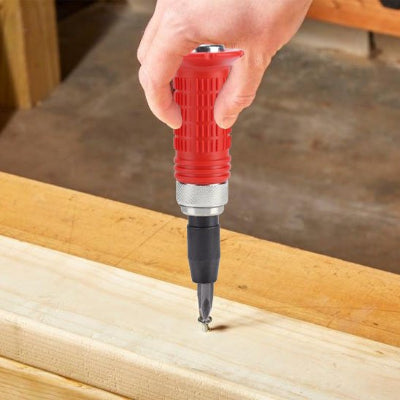 Tournevis a frapper utilisé dans une base de bois 